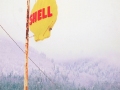 Shell sign and house.